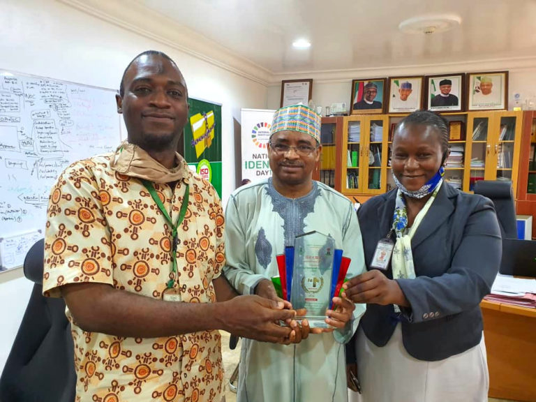 NIMC DG/CEO with the Corporate Web Management team holding the First Position award from BPSR